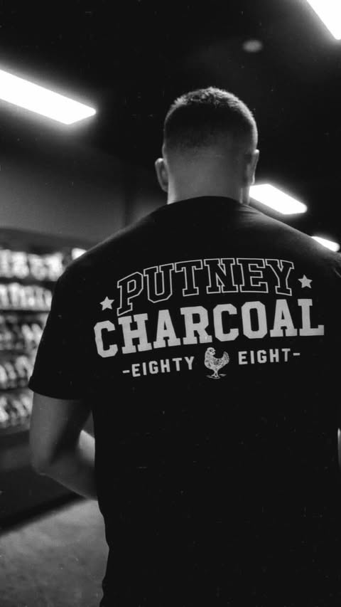 Putney Charcoal staff in 'Eighty Eight' shirt on the shop floor